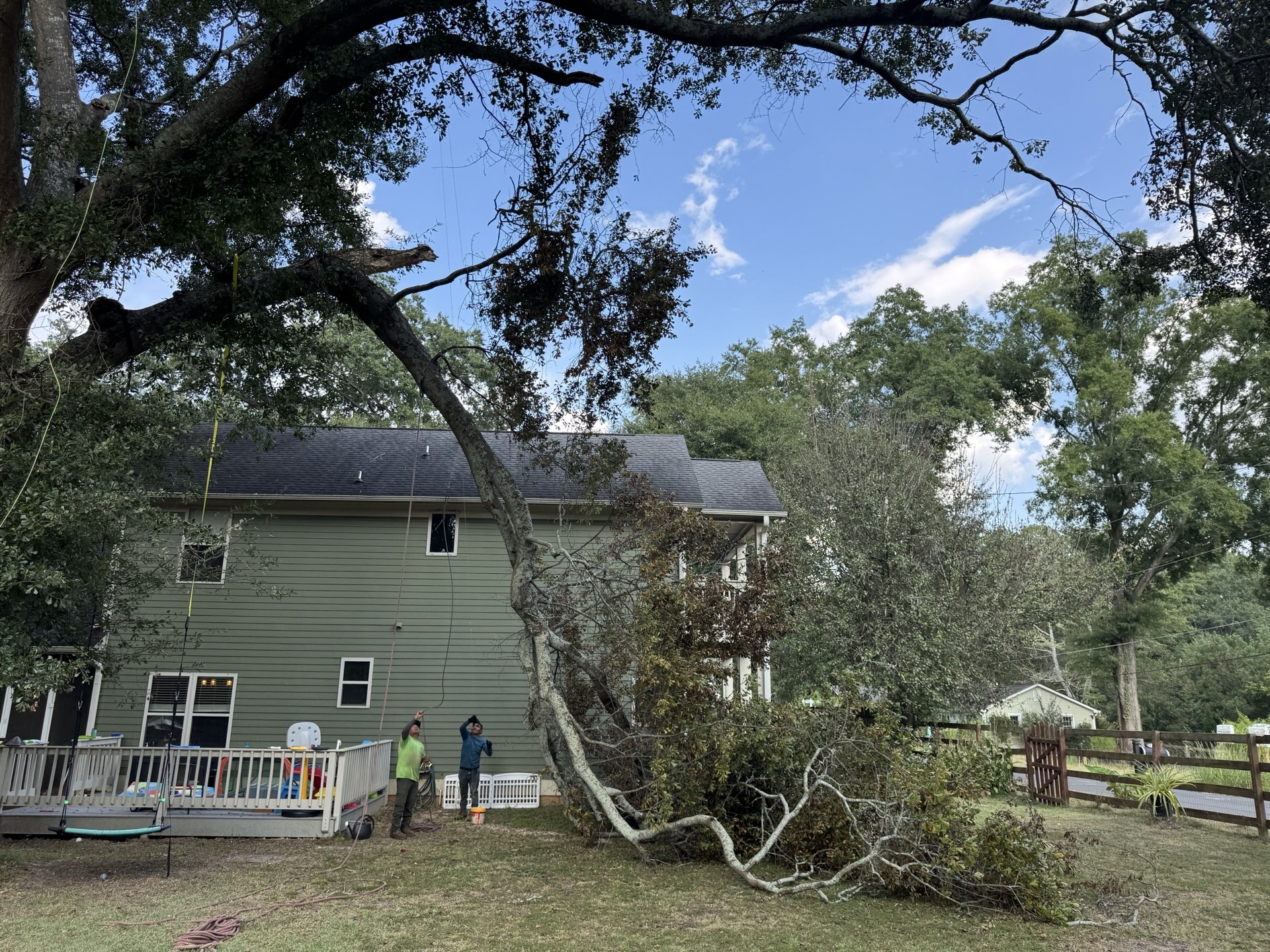 Before: Snapped oak branch threatening a back deck in Acworth GA