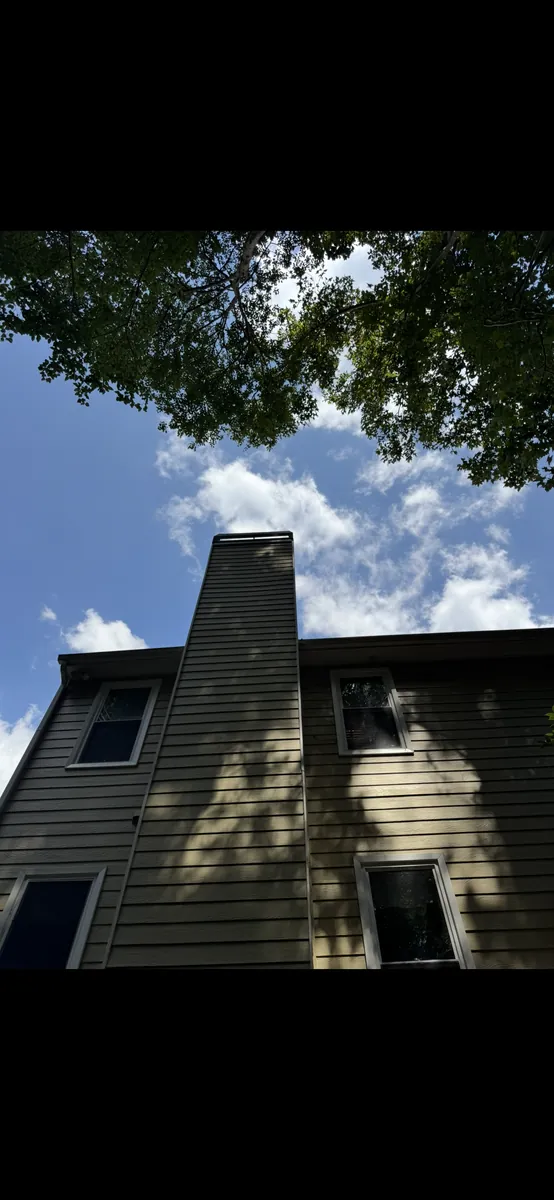 After: tree pruning away from fireplace chimney in Dallas, GA
