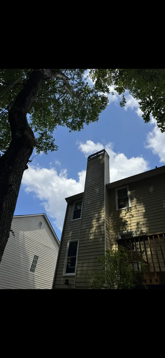 After: tree pruning away from fireplace chimney in Dallas, GA